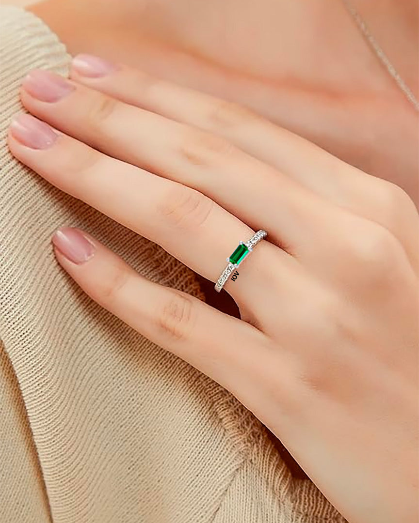 One line CZ band with rectangular emerald color stone.