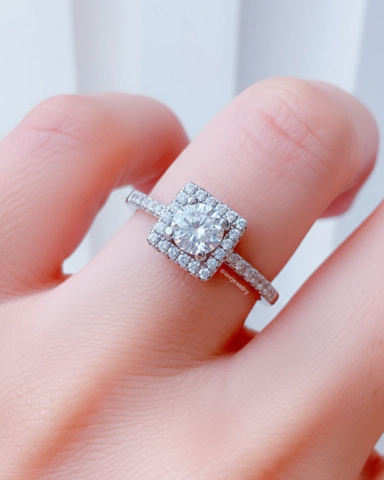 solitaire round CZ stone in square halo setting.