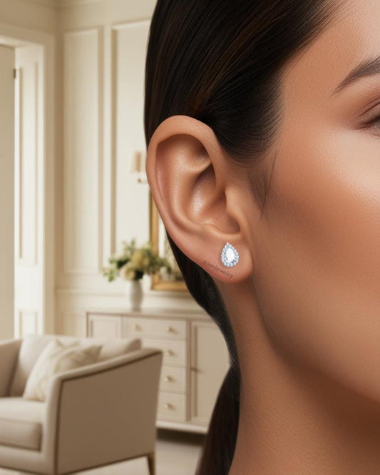 CZ pear shape in a halo setting stud earring.