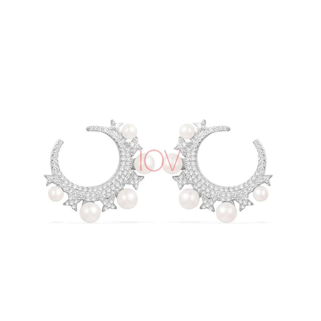 Crescent shape earrings with pearl.