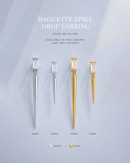 Baguette stone stud earring with dangling cone shape.