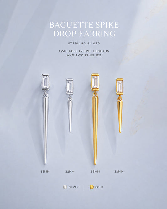 Baguette stone stud earring with dangling cone shape.