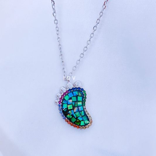 foot shape necklace with opal inlay.
