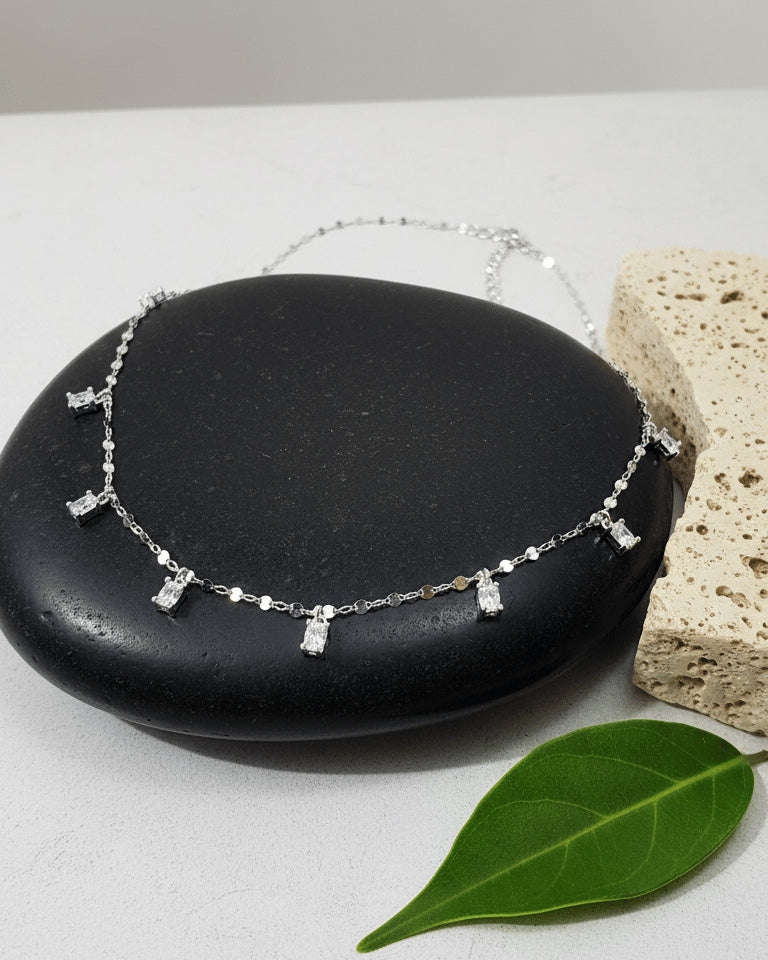 mirror link chain with dangling CZ oval shape stones.
