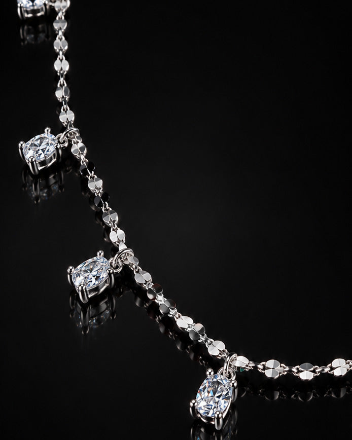 mirror link chain with dangling CZ oval shape stones.