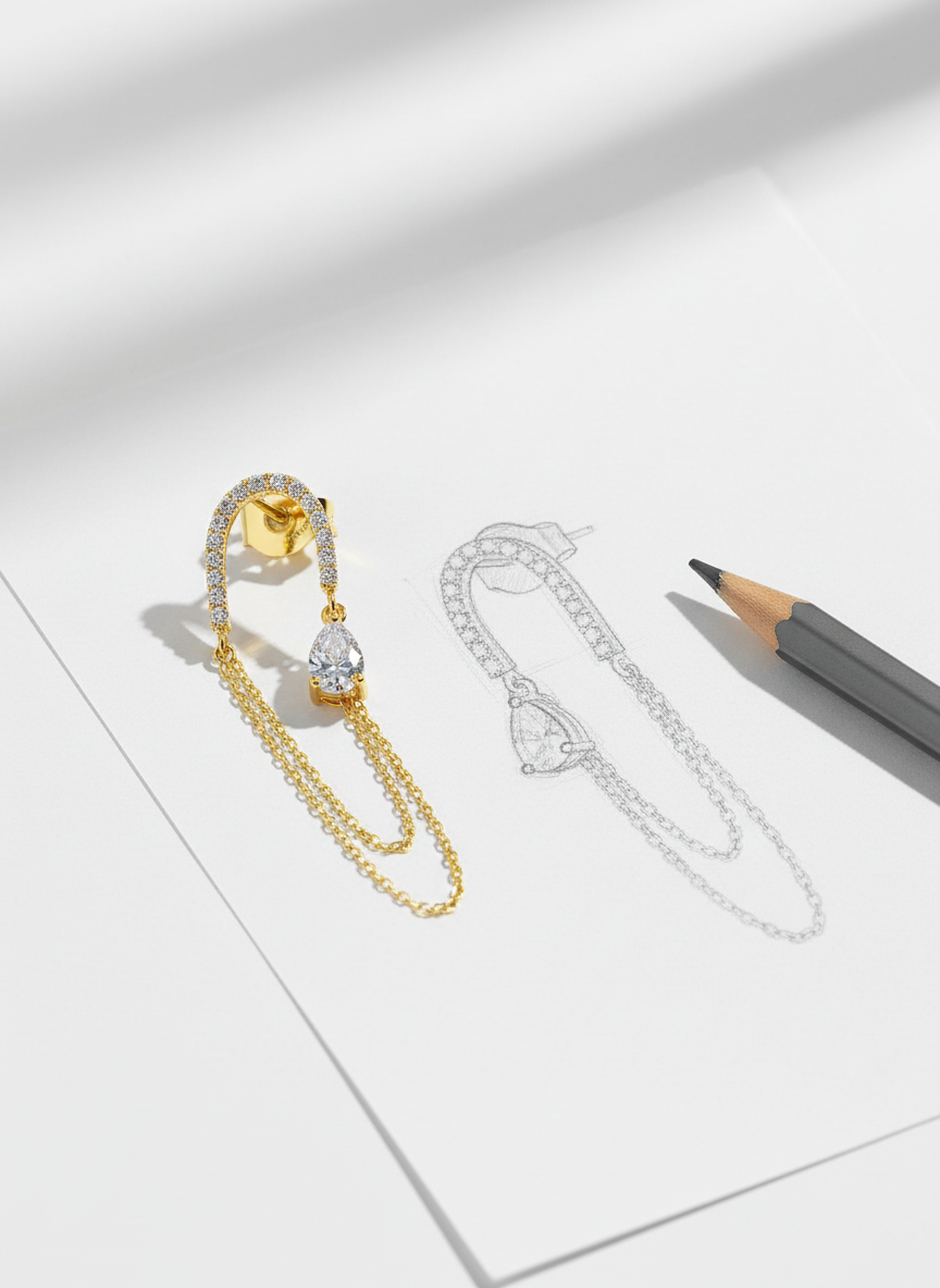 Long double chain dangling earring with pear shape CZ stone.