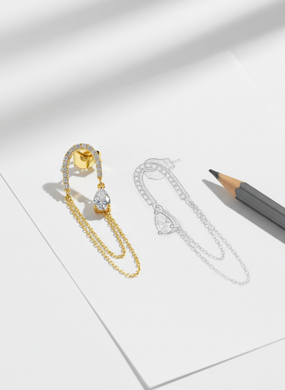 Long double chain dangling earring with pear shape CZ stone.