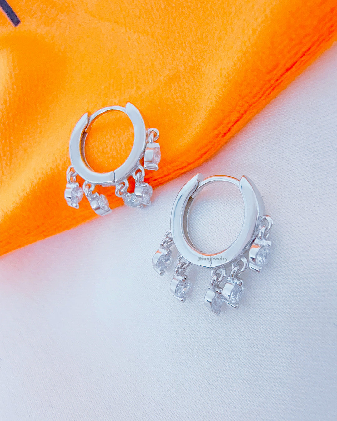 9 mm plain huggie hoop with dangling round CZ.