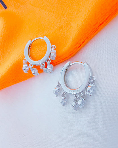 9 mm plain huggie hoop with dangling round CZ.