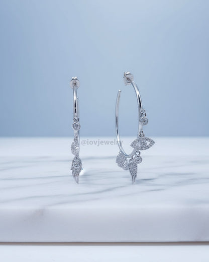 wide plain hoop with dangling CZ charms.