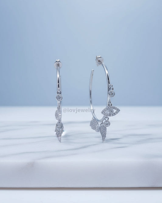 wide plain hoop with dangling CZ charms.