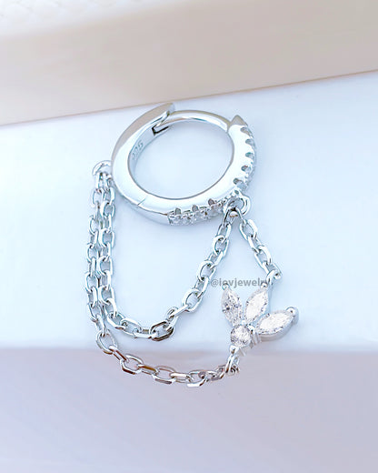 CZ huggie hoop with dangling double chains adorned with louts shape marquise stones.