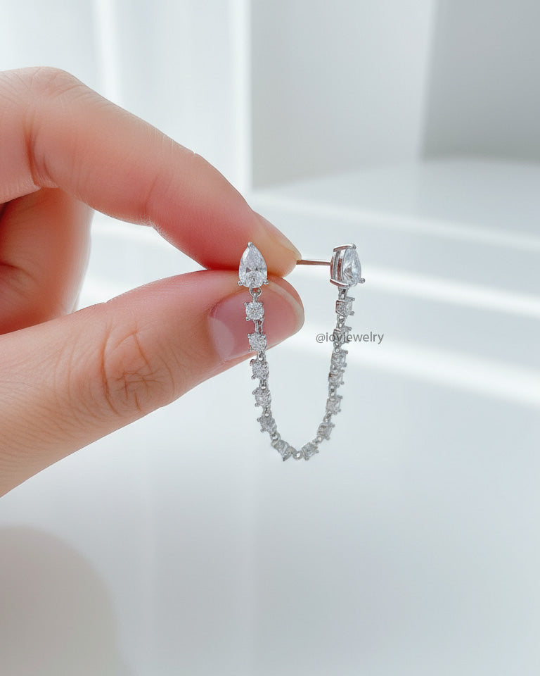 double stud Pear and round connected CZ earring.