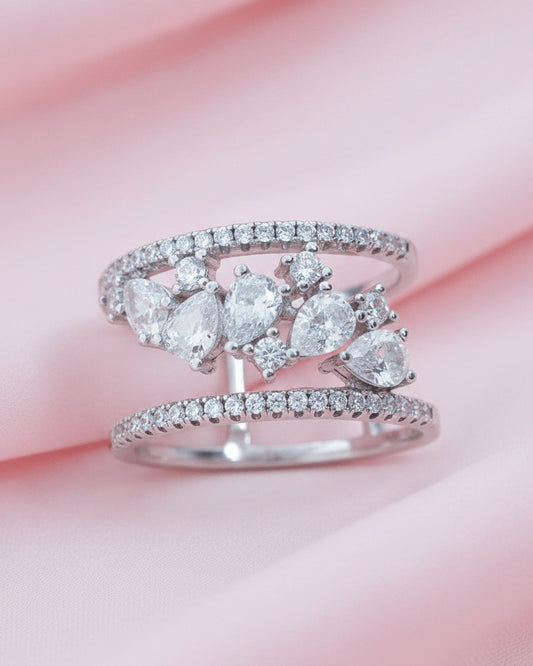 cage style ring of pear and round CZ.