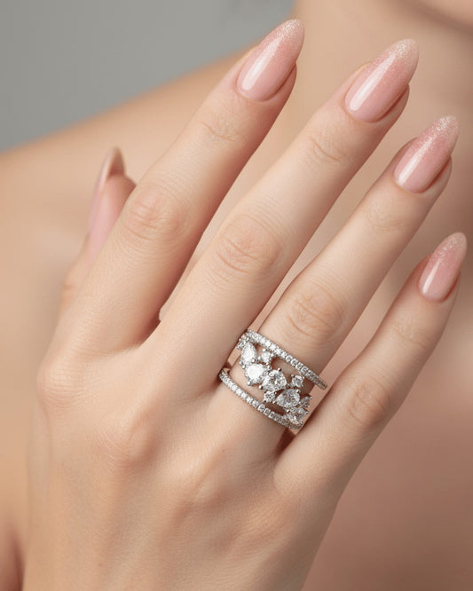 cage style ring of pear and round CZ.