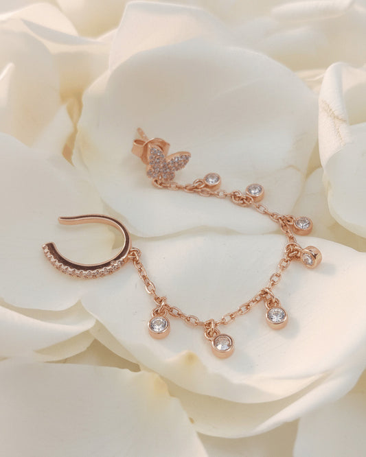 sterling silver rosegold plated butterfly stud earring linked to earcuff with dangling CZ in bezel setting.