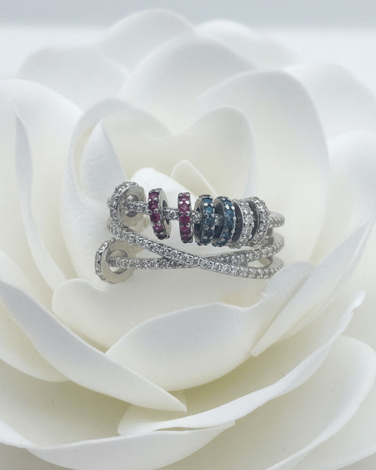 X shape ring with movable links of colored CZ.