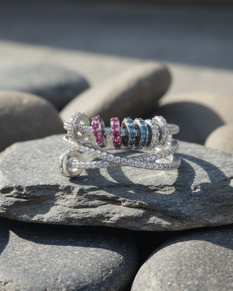 X shape ring with movable links of colored CZ.