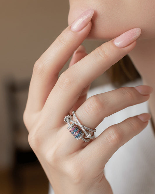 X shape ring with movable links of colored CZ.