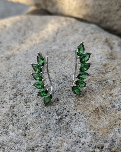 Climber style emerald and ruby color earrings.