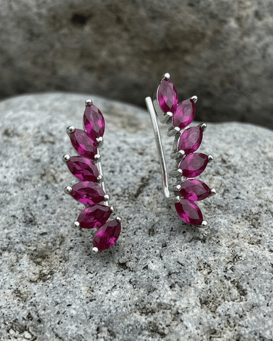 Climber style emerald and ruby color earrings.