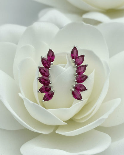 Climber style emerald and ruby color earrings.