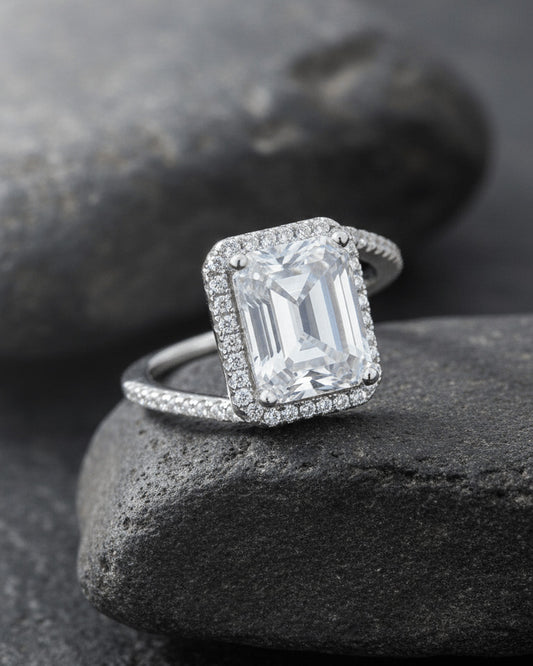 CZ emerald cut in halo setting solitaire ring.