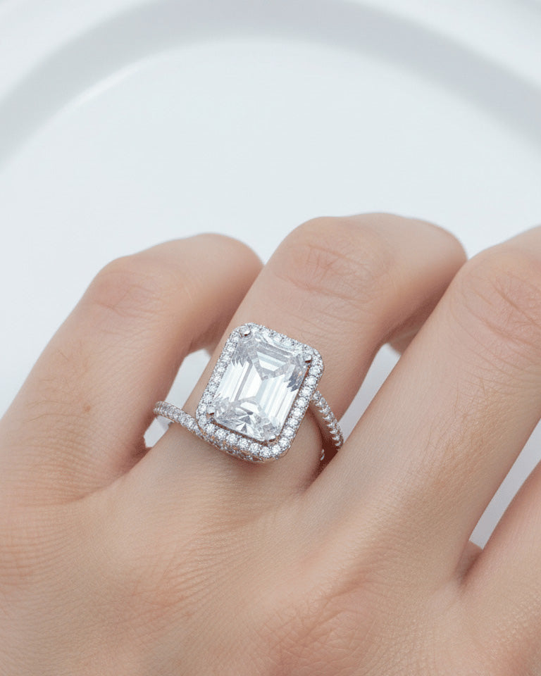 CZ emerald cut in halo setting solitaire ring.