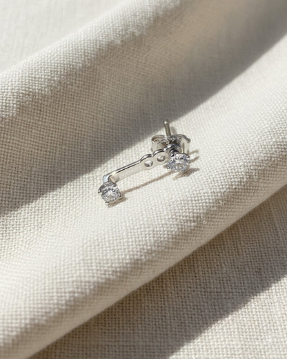 minimal back to front two round CZ earring.