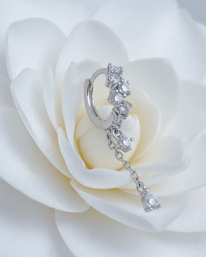 uneven Round CZ arrangement huggie hoop with dangling double chain.