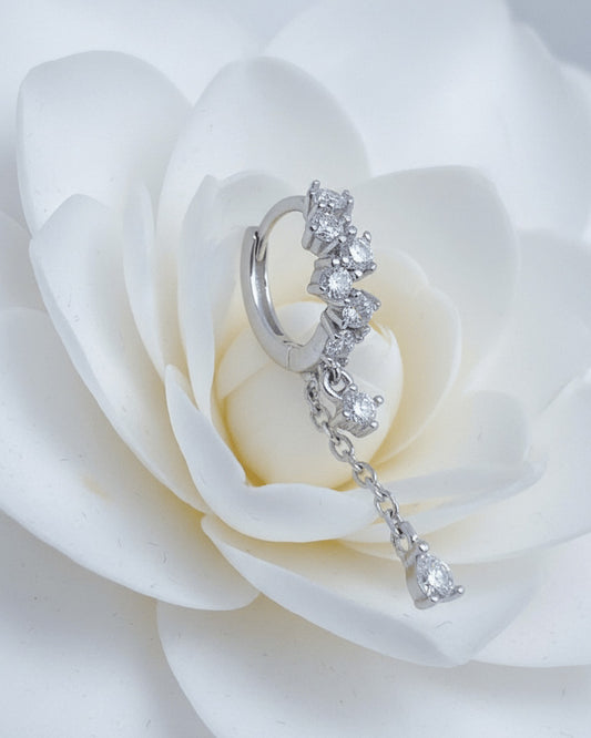 uneven Round CZ arrangement huggie hoop with dangling double chain.