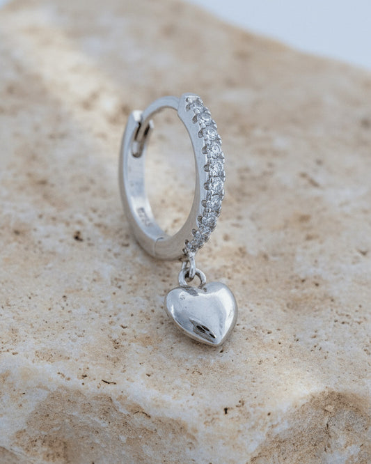CZ huggie hoop earring with dangling plain heart shape.