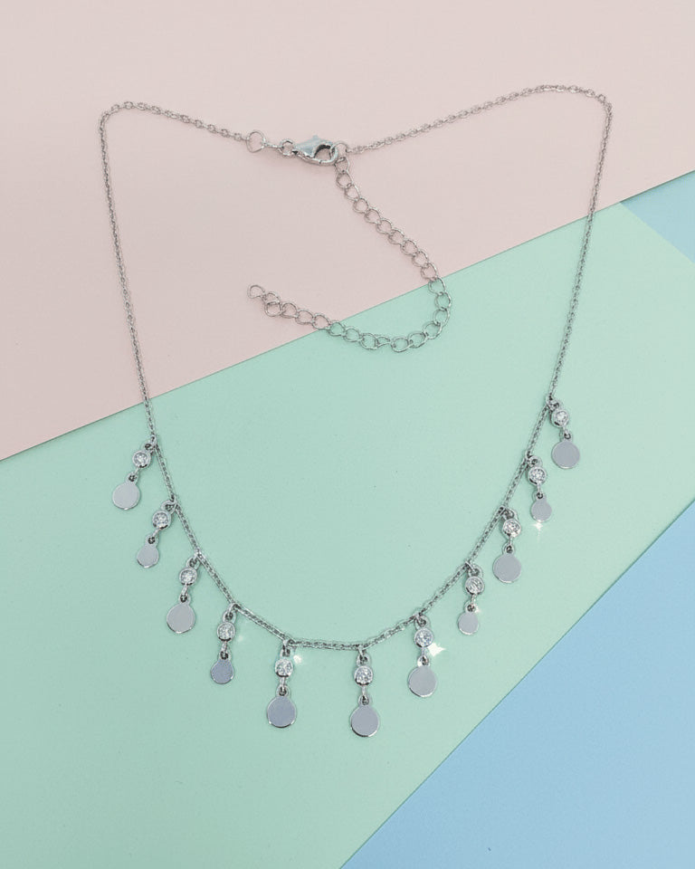 choker of plain disks shapes with CZ in bezel setting.
