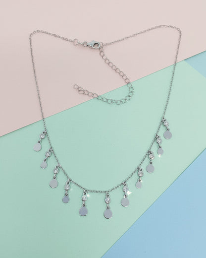 choker of plain disks shapes with CZ in bezel setting.