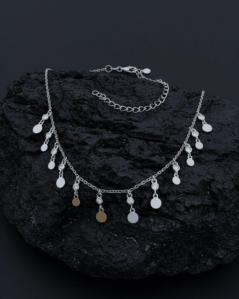 choker of plain disks shapes with CZ in bezel setting.