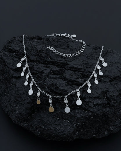 choker of plain disks shapes with CZ in bezel setting.