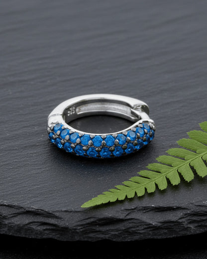 huggie emerald and sapphire three rows of stones earring.