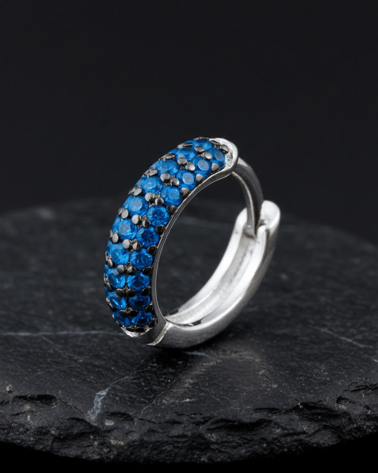 huggie emerald and sapphire three rows of stones earring.