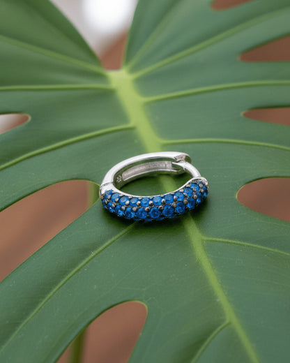 huggie emerald and sapphire three rows of stones earring.
