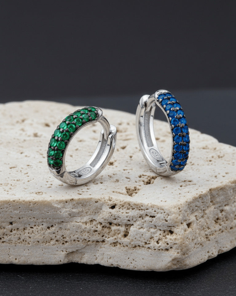 huggie emerald and sapphire three rows of stones earring.