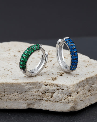 huggie emerald and sapphire three rows of stones earring.