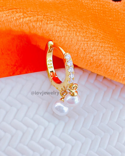 CZ huggie hoop earring with dangling two pearls.