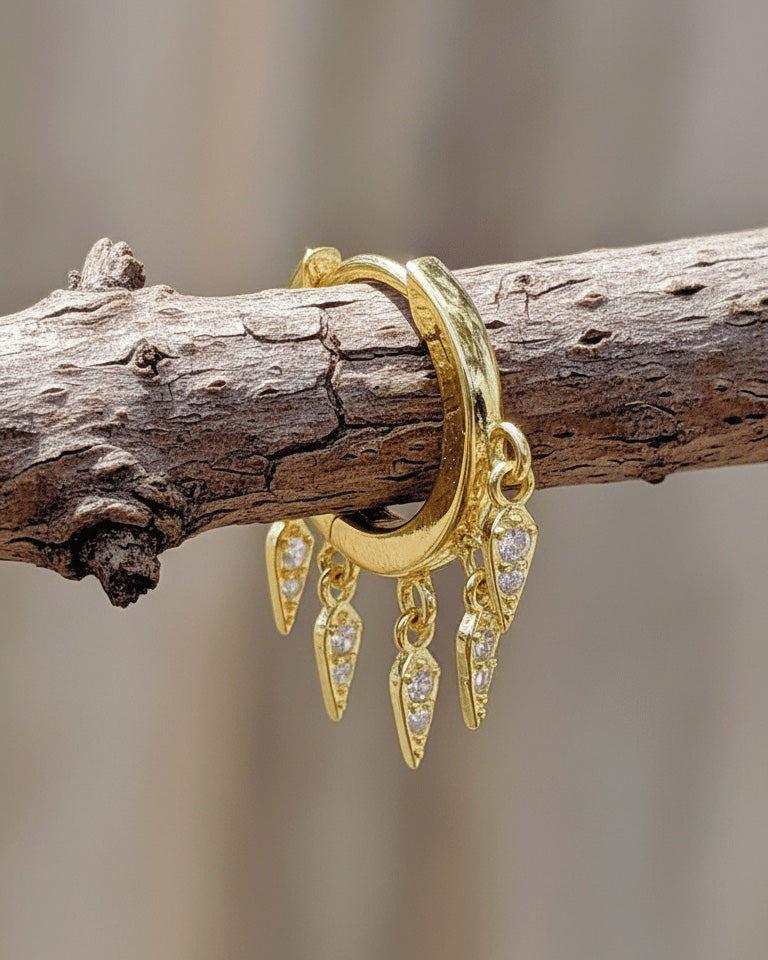 plain huggie hoop with dangling kite shapes with CZ.