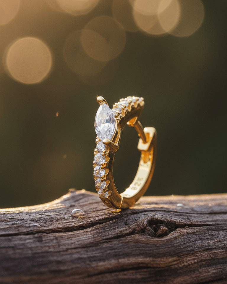 10 mm CZ huggie hoop with center tilted marquise shape stone.