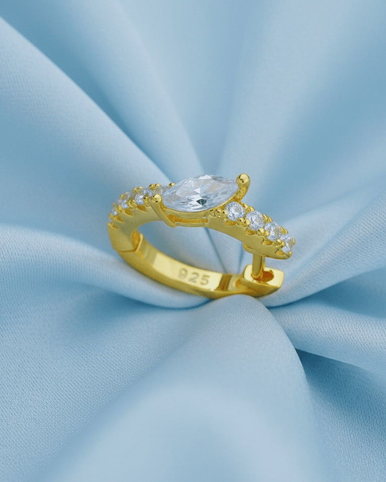 10 mm CZ huggie hoop with center tilted marquise shape stone.