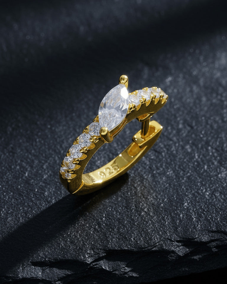 10 mm CZ huggie hoop with center tilted marquise shape stone.