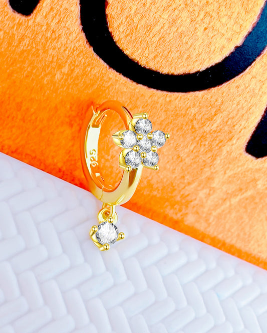 flower cluster setting huggie hoop earring with dangling stone.