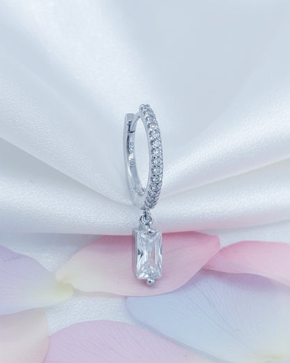 10 mm CZ hoop with dangling rectangular baguette shape stone.