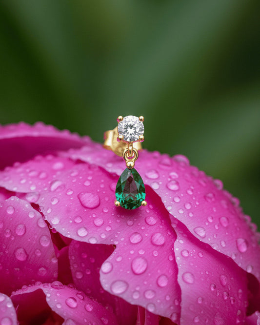 round stone stud earring with dangling emerald color pear shape stone.