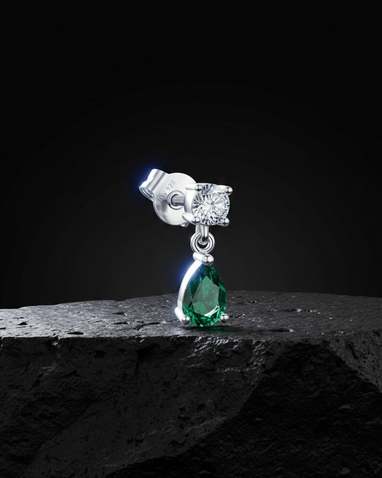 round stone stud earring with dangling emerald color pear shape stone.